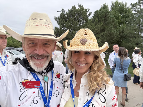 Doug Tisdale with community supporters at an outdoor event